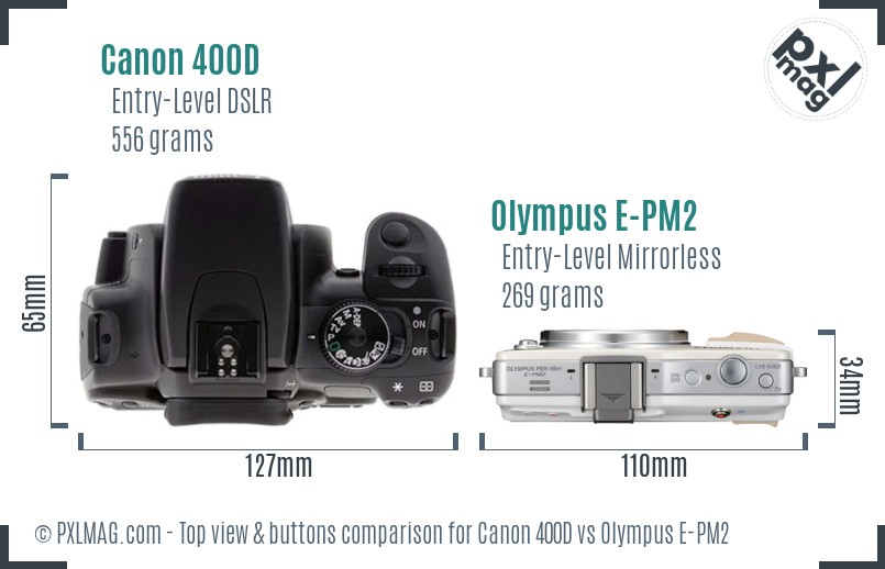 Canon 400D vs Olympus E-PM2 top view buttons comparison