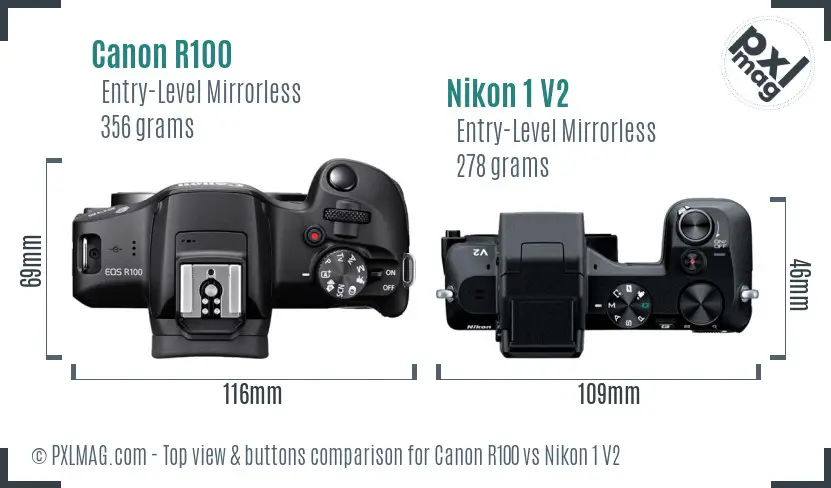 Canon R100 vs Nikon 1 V2 top view buttons comparison
