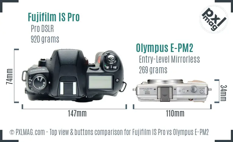 Fujifilm IS Pro vs Olympus E-PM2 top view buttons comparison Fujifilm IS Pro vs Olympus E-PM2 top view buttons comparison