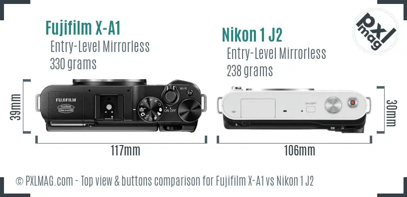 Fujifilm X-A1 vs Nikon 1 J2 top view buttons comparison