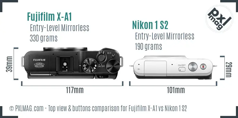 Fujifilm X-A1 vs Nikon 1 S2 top view buttons comparison