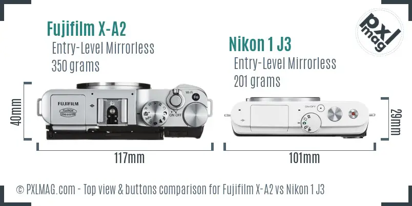 Fujifilm X-A2 vs Nikon 1 J3 top view buttons comparison