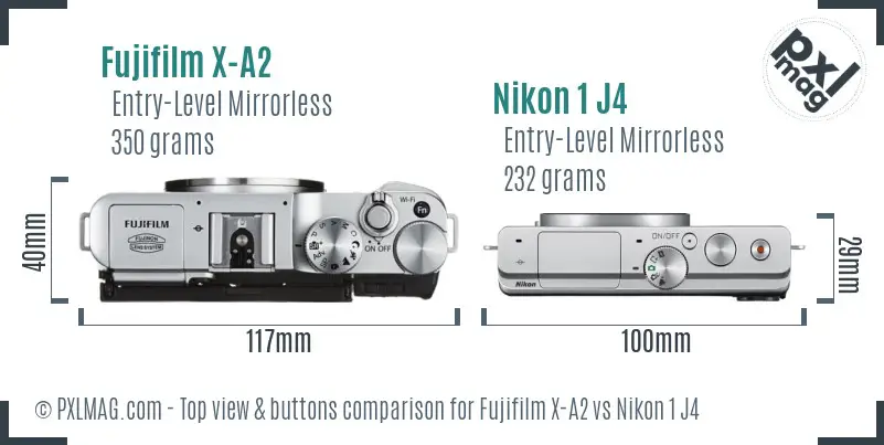 Fujifilm X-A2 vs Nikon 1 J4 top view buttons comparison