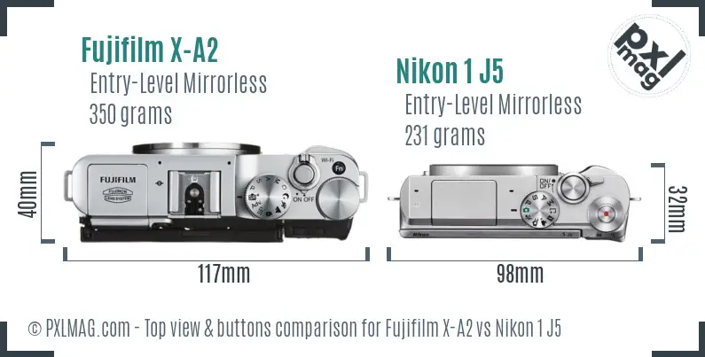 Fujifilm X-A2 vs Nikon 1 J5 top view buttons comparison
