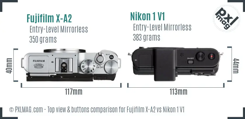 Fujifilm X-A2 vs Nikon 1 V1 top view buttons comparison