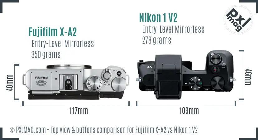 Fujifilm X-A2 vs Nikon 1 V2 top view buttons comparison Fujifilm X-A2 vs Nikon 1 V2 top view buttons comparison