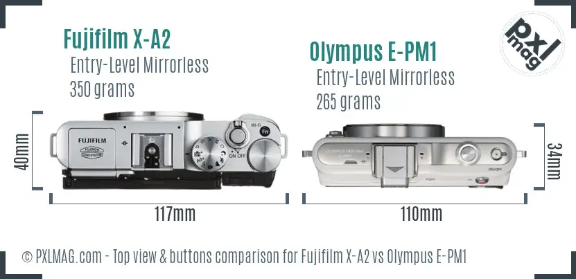 Fujifilm X-A2 vs Olympus E-PM1 top view buttons comparison