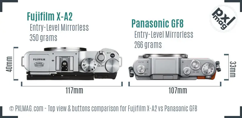Fujifilm X-A2 vs Panasonic GF8 top view buttons comparison Fujifilm X-A2 vs Panasonic GF8 top view buttons comparison