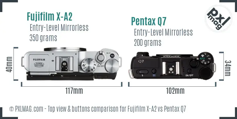 Fujifilm X-A2 vs Pentax Q7 top view buttons comparison