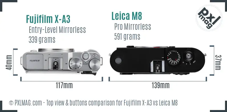 Fujifilm X-A3 vs Leica M8 top view buttons comparison Fujifilm X-A3 vs Leica M8 top view buttons comparison