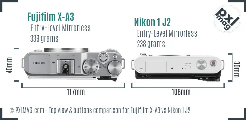 Fujifilm X-A3 vs Nikon 1 J2 top view buttons comparison Fujifilm X-A3 vs Nikon 1 J2 top view buttons comparison