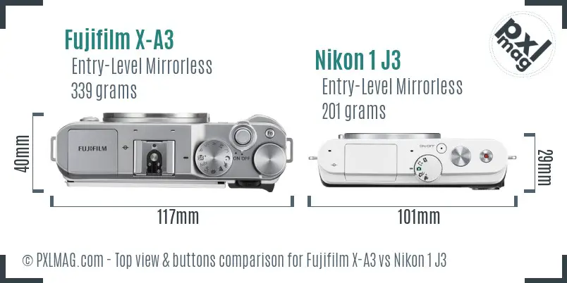 Fujifilm X-A3 vs Nikon 1 J3 top view buttons comparison