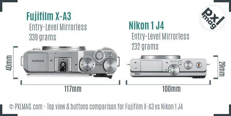 Fujifilm X-A3 vs Nikon 1 J4 top view buttons comparison