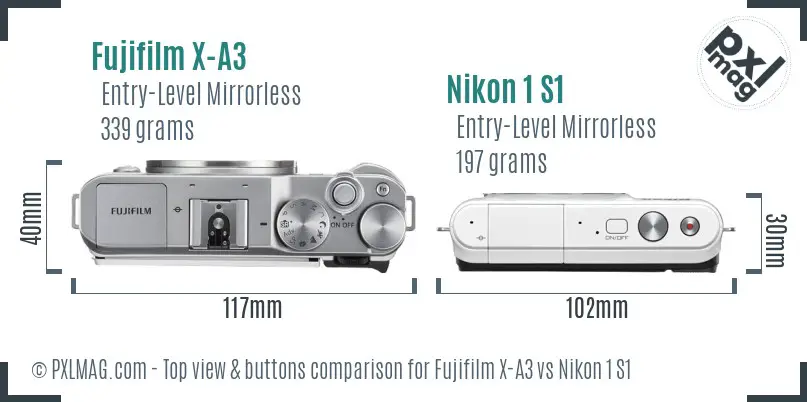 Fujifilm X-A3 vs Nikon 1 S1 top view buttons comparison