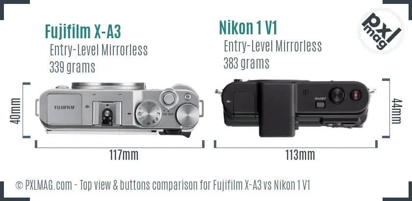 Fujifilm X-A3 vs Nikon 1 V1 top view buttons comparison