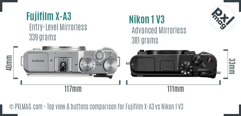 Fujifilm X-A3 vs Nikon 1 V3 top view buttons comparison