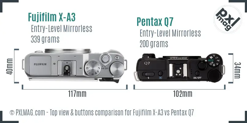 Fujifilm X-A3 vs Pentax Q7 top view buttons comparison