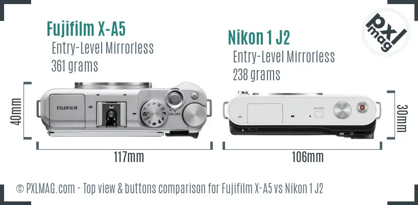 Fujifilm X-A5 vs Nikon 1 J2 top view buttons comparison