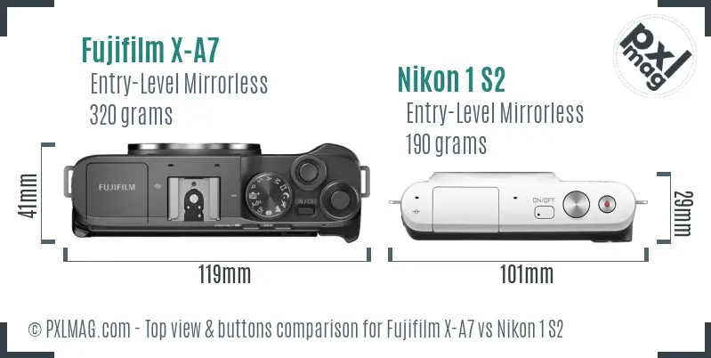 Fujifilm X-A7 vs Nikon 1 S2 top view buttons comparison