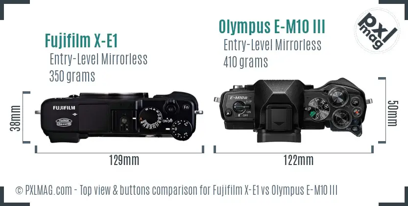 Fujifilm X-E1 vs Olympus E-M10 III top view buttons comparison