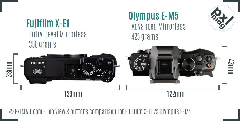 Fujifilm X-E1 vs Olympus E-M5 top view buttons comparison Fujifilm X-E1 vs Olympus E-M5 top view buttons comparison