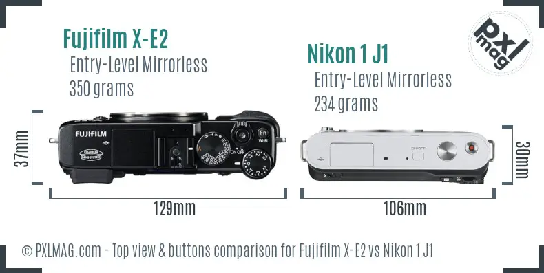 Fujifilm X-E2 vs Nikon 1 J1 top view buttons comparison