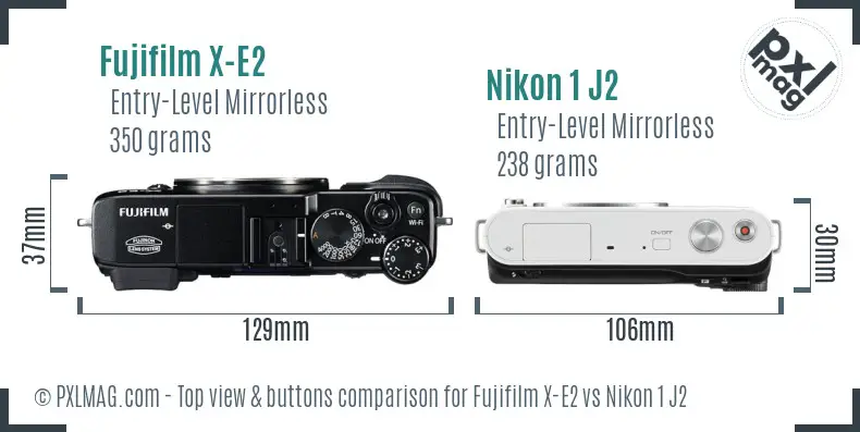 Fujifilm X-E2 vs Nikon 1 J2 top view buttons comparison