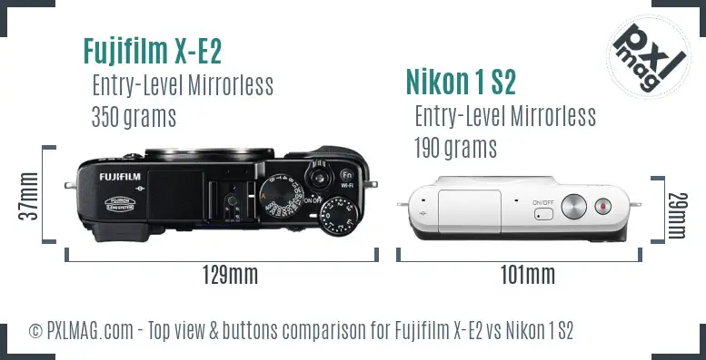 Fujifilm X-E2 vs Nikon 1 S2 top view buttons comparison