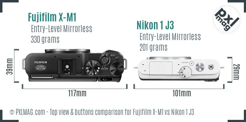 Fujifilm X-M1 vs Nikon 1 J3 top view buttons comparison Fujifilm X-M1 vs Nikon 1 J3 top view buttons comparison