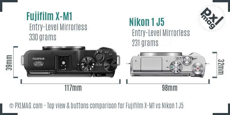 Fujifilm X-M1 vs Nikon 1 J5 top view buttons comparison