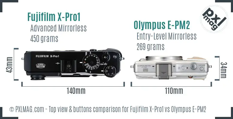 Fujifilm X-Pro1 vs Olympus E-PM2 top view buttons comparison Fujifilm X-Pro1 vs Olympus E-PM2 top view buttons comparison