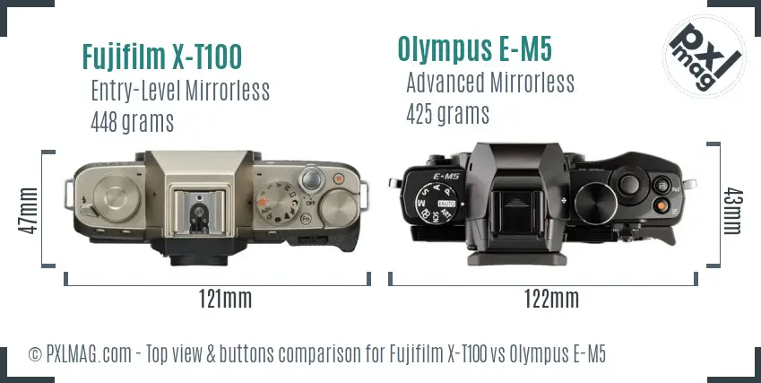 Fujifilm X-T100 vs Olympus E-M5 top view buttons comparison Fujifilm X-T100 vs Olympus E-M5 top view buttons comparison