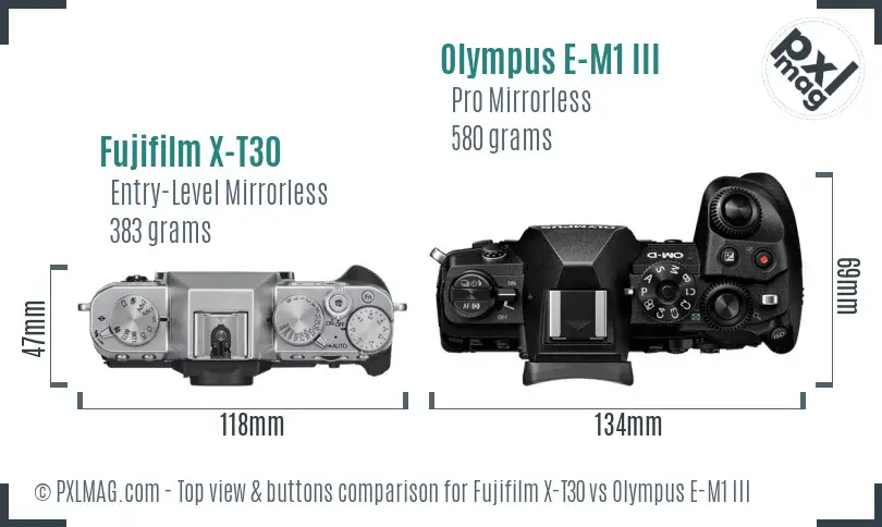Fujifilm X-T30 vs Olympus E-M1 III top view buttons comparison