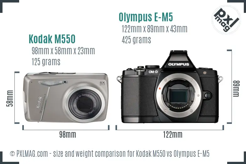 Kodak M550 vs Olympus E-M5 size comparison