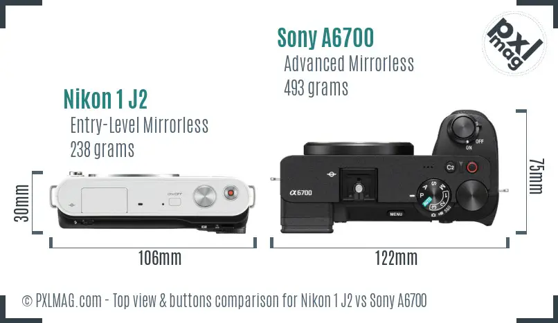 Nikon 1 J2 vs Sony A6700 top view buttons comparison Nikon 1 J2 vs Sony A6700 top view buttons comparison