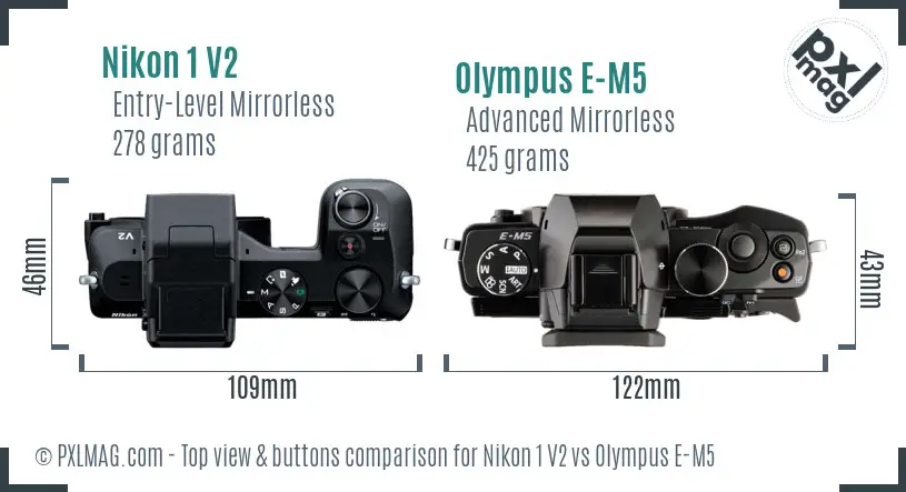 Nikon 1 V2 vs Olympus E-M5 top view buttons comparison Nikon 1 V2 vs Olympus E-M5 top view buttons comparison