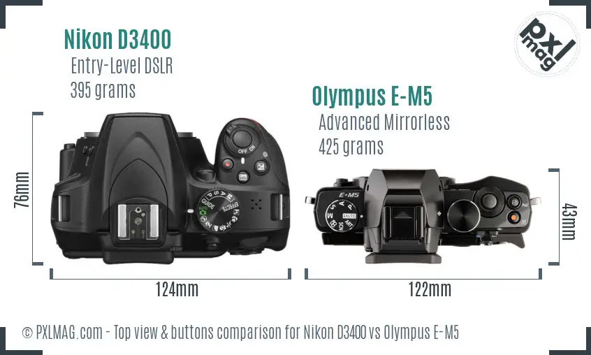 Nikon D3400 vs Olympus E-M5 top view buttons comparison