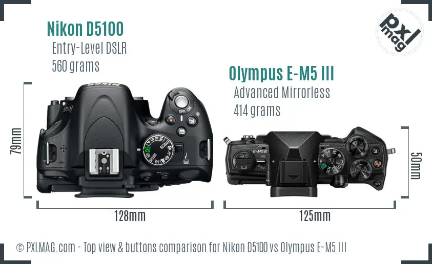 Nikon D5100 vs Olympus E-M5 III top view buttons comparison
