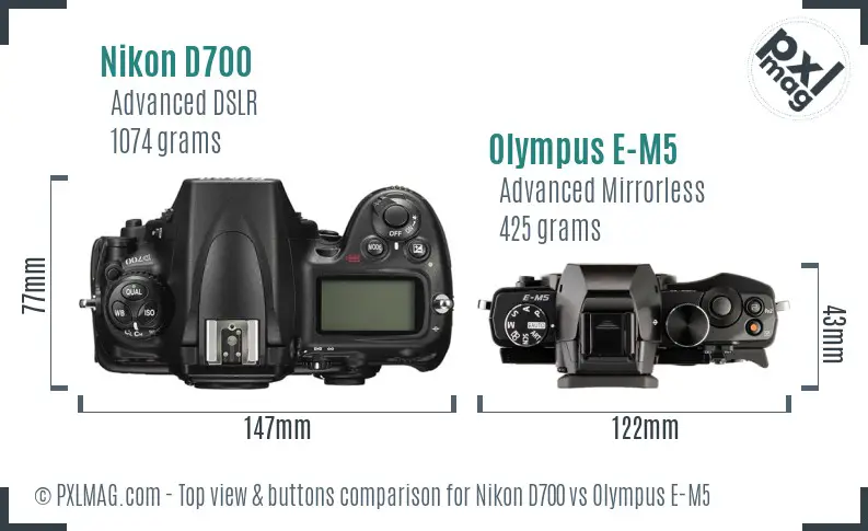 Nikon D700 vs Olympus E-M5 top view buttons comparison