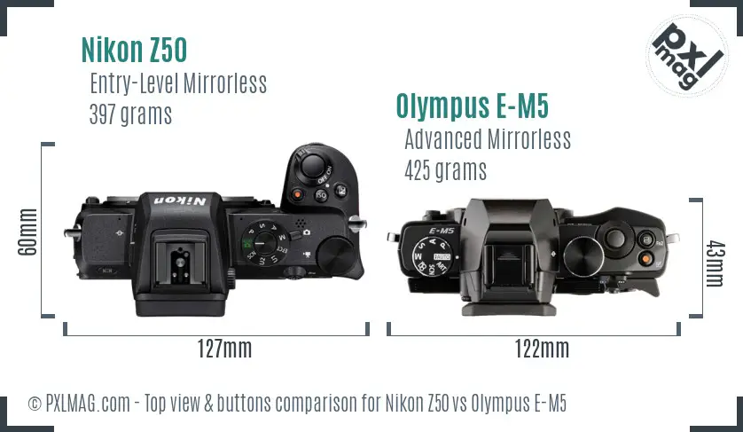 Nikon Z50 vs Olympus E-M5 top view buttons comparison