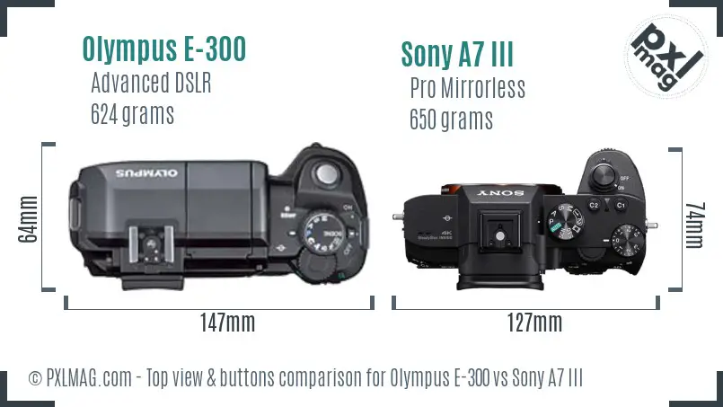 Olympus E-300 vs Sony A7 III top view buttons comparison