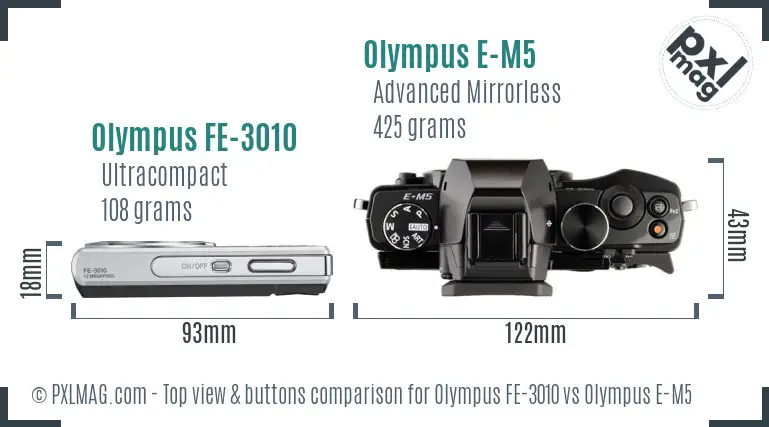 Olympus FE-3010 vs Olympus E-M5 top view buttons comparison
