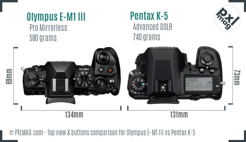 Olympus E-M1 III vs Pentax K-5 top view buttons comparison