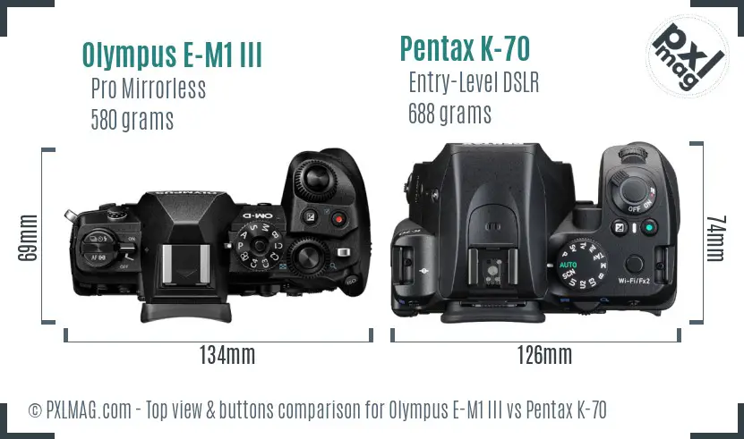 Olympus E-M1 III vs Pentax K-70 top view buttons comparison