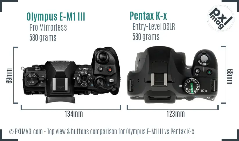 Olympus E-M1 III vs Pentax K-x top view buttons comparison
