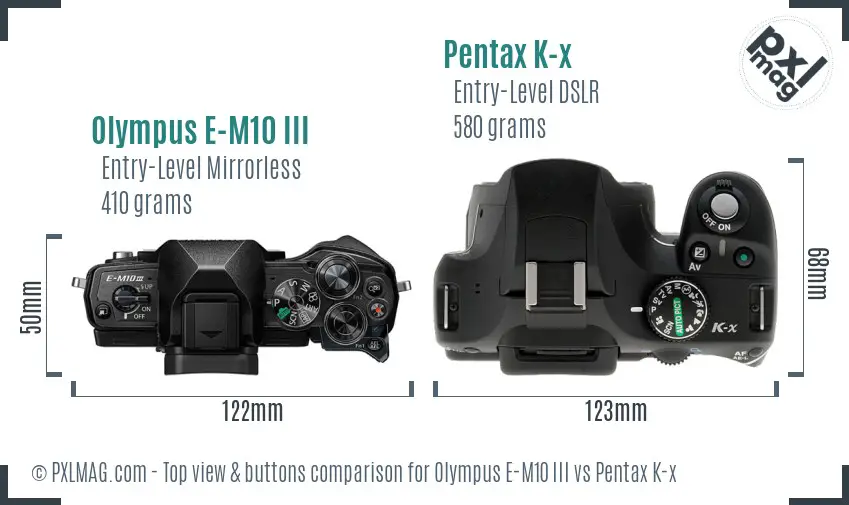 Olympus E-M10 III vs Pentax K-x top view buttons comparison
