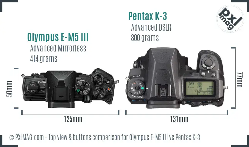Olympus E-M5 III vs Pentax K-3 top view buttons comparison