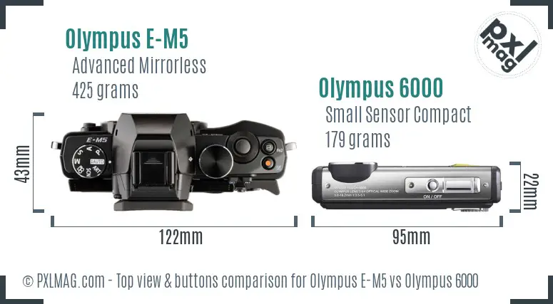 Olympus E-M5 vs Olympus 6000 top view buttons comparison