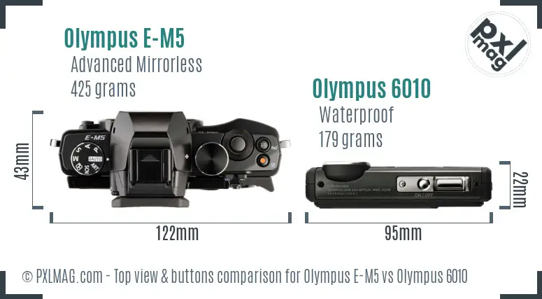 Olympus E-M5 vs Olympus 6010 top view buttons comparison