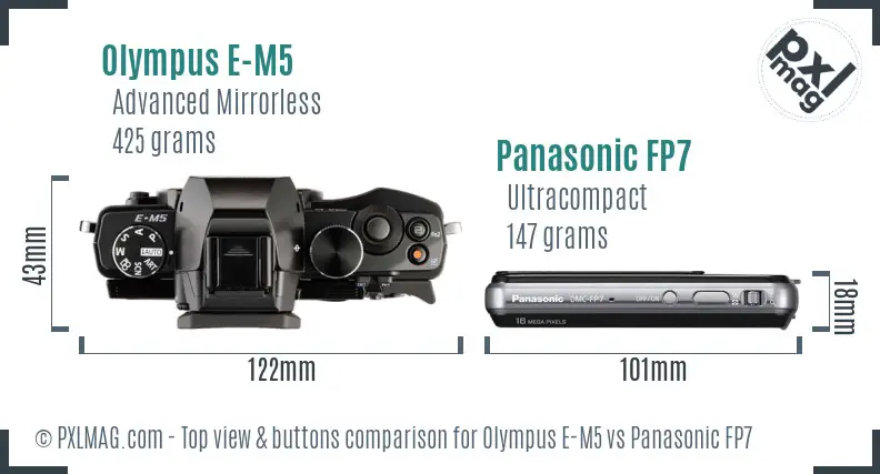 Olympus E-M5 vs Panasonic FP7 top view buttons comparison